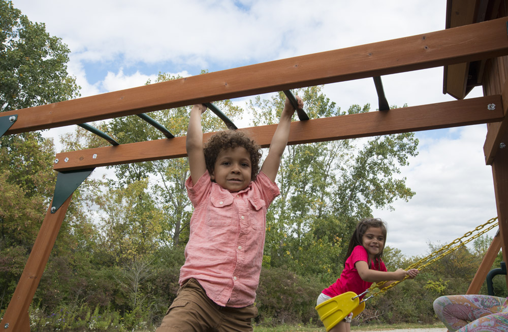 boy-playing-on-monkey-bars__80616_zoom